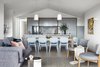 Modern home with Living Room, Coffee Tables, Sofa, Chair, Light Hardwood Floor, Pendant Lighting, and Rug Floor. Kitchen, Meals & Living area Photo 6 of Yeronga House