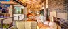 Modern home with Living Room, Sofa, Coffee Tables, and Wood Burning Fireplace. "Outdoor"/indoor living room with 26' wide bifold door system to make the space feel open when desired Photo 3 of Shifting Shores