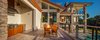 Modern home with Exterior, House Building Type, and Stucco Siding Material. Outdoor kitchen and bar area overlooking the pool and water Photo 5 of Shifting Shores