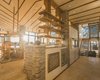 Modern home with Hallway and Slate Floor. Front entry hallway looking through the wet bar into kitchen/living room area Photo 9 of Shifting Shores