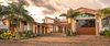 Modern home with Exterior, Stone Siding Material, House Building Type, Flat RoofLine, A-Frame RoofLine, Stucco Siding Material, and Gable RoofLine. Front of Home Photo 10 of Shifting Shores