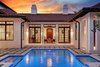 Modern home with Exterior, Shingles Roof Material, Gable RoofLine, Stucco Siding Material, and House Building Type. Looking into the sitting room through at the front door from pool area Photo 2 of Spice Bay