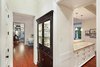 Modern home with Dark Hardwood Floor. Hallway leading into both kitchen and living room Photo 11 of Spice Bay