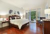 Modern home with Chair, Dark Hardwood Floor, and Ceiling Lighting. Master Bedroom Photo 12 of Spice Bay