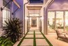 Modern home with Outdoor, Large Patio, Porch, Deck, Side Yard, Grass, Shrubs, Gardens, Post Lighting, Hardscapes, and Walkways. Pool entry Photo 7 of Venice Beach Cottage