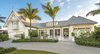 Modern home with Exterior, House Building Type, Stucco Siding Material, Metal Roof Material, and Gable RoofLine. Front of the house Photo of Venice Beach Cottage