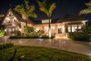 Modern home with Exterior, House Building Type, Stucco Siding Material, Gable RoofLine, and Metal Roof Material. Front of House at night Photo 13 of Venice Beach Cottage
