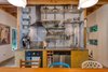 Modern home with Kitchen. Kitchen with open low maintenance metal shelving. Photo 10 of Guemes Island Home