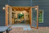 Outside picnics and dining steps away from the kitchen. Photo 9 of Guemes Island Home modern home