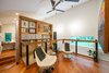 Modern home with Pendant Lighting, Chair, and Ceiling Lighting. Cable railings extend across the open loft area, while open shelving houses colorful art. Photo 16 of Guemes Island Home