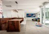 Modern home with Living Room, Bench, Chair, Ceiling Lighting, Porcelain Tile Floor, and Pendant Lighting. Communal area Photo 5 of The Leichler