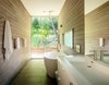 Modern home with Bath Room, Engineered Quartz Counter, One Piece Toilet, Soaking Tub, Porcelain Tile Floor, Open Shower, Ceiling Lighting, and Freestanding Tub. Master bathroom Photo 7 of The Leichler