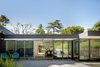 Modern home with Exterior, Wood Siding Material, House Building Type, and Flat RoofLine. Rear of home Photo 8 of The Leichler