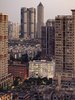 Apartment buildings at dusk in a city of tall buildings Photo 3 of THE VILLAGE modern home