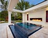 Modern home with Outdoor, Large Patio, Porch, Deck, Large Pools, Tubs, Shower, Back Yard, and Swimming Pools, Tubs, Shower. Upon entering this outdoor space, the atmosphere of a resort surrounds you and the raised spa makes for a perfect vantage point for taking it all in. The linear fire feature is another stunning and memorable element of this space. Photo 4 of Modern Tranquility