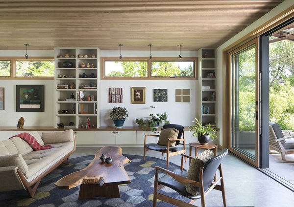 The great room features a sound-dampening ceiling made of strips of Douglas fir laid over recycled denim insulation.