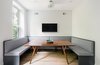Modern home with Dining Room, Table, Light Hardwood Floor, and Bench. A large, custom-built banquet offers the perfect space to start and end your day.
Photo 6 of A Bedford-Stuyvesant home that celebrates lifestyle
