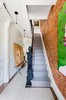 Modern home with Staircase and Wood Railing. Stairs in the owner's triplex lead up to 4 bedrooms and 3 bathrooms. Photo 7 of A Bedford-Stuyvesant home that celebrates lifestyle