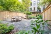 A spacious, landscaped backyard -- ideal for entertaining or relaxing. Photo 13 of A Bedford-Stuyvesant home that celebrates lifestyle modern home