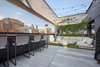 Modern home with Outdoor, Rooftop, Shrubs, and Hanging Lighting. This oasis is just as incredible at night, with lovely lighting and dazzling city skyline views. Photo 5 of A Brooklyn Penthouse With Three Terraces