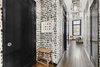 Modern home with Hallway and Medium Hardwood Floor. Guests are greeted in an entryway that pops Photo 2 of Expansive Pre-War Architecture Meets Stylish and Modern Living