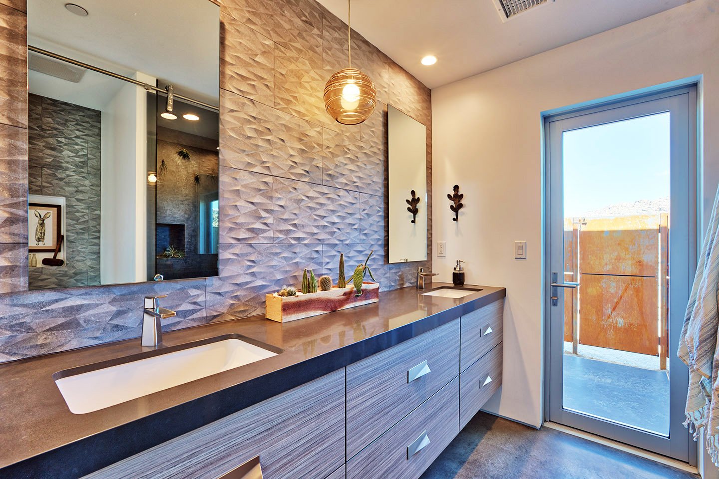 Main bathroom with door to outdoor shower