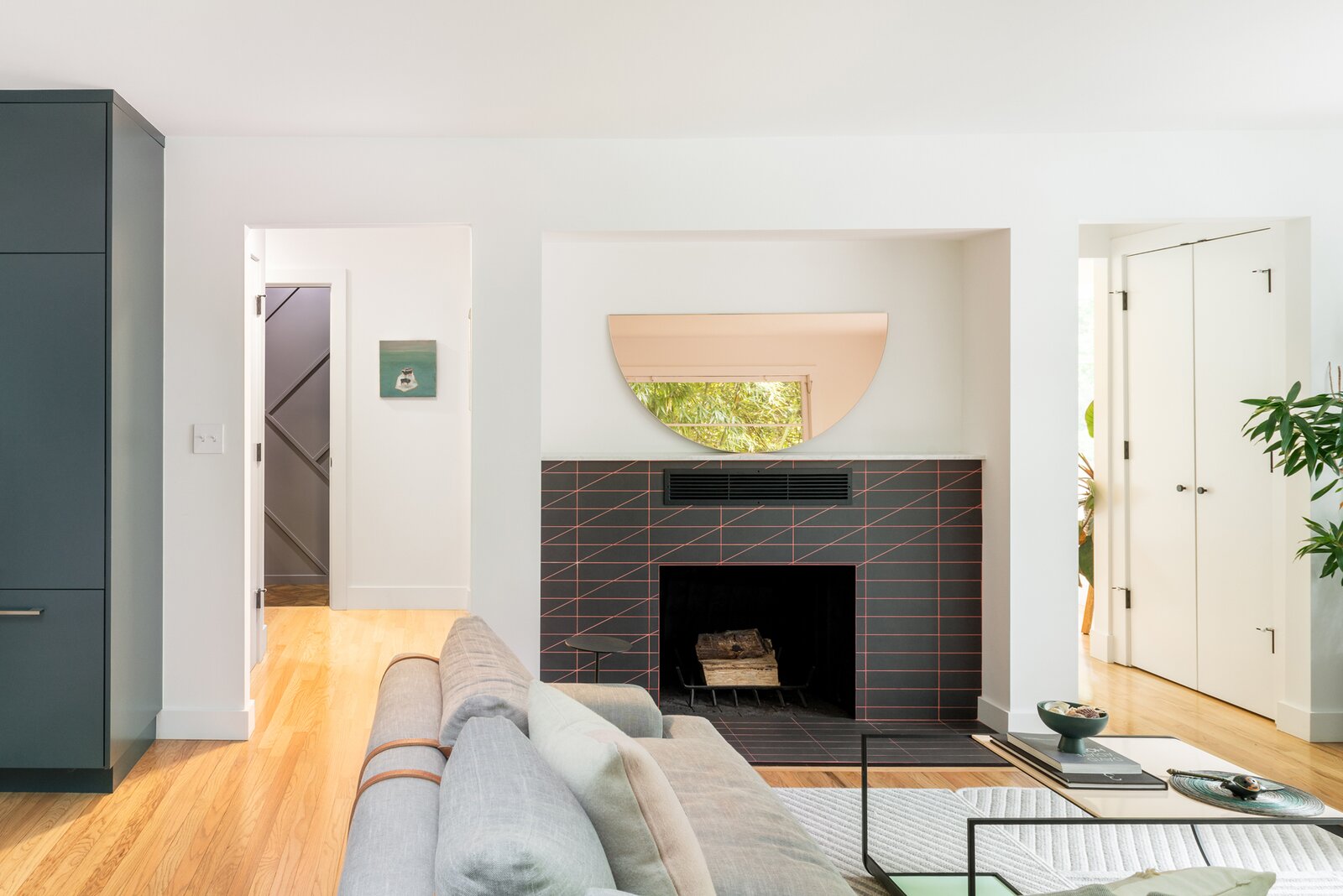 After: The new fireplace surround is make of Cava Tile and a custom salmon pink grout that Michelle mixed with the contractor. "I could have ordered something off the shelf, but this enabled me more freedom to get the color closer to what I wanted,