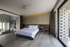Modern home with Bedroom, Light Hardwood Floor, Ceiling Lighting, and Bed. Master bedroom Photo 10 of Cascading House