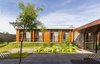 Modern home with Outdoor, Back Yard, Large Pools, Tubs, Shower, Trees, and Gardens. The house of 330m² has a simple program besides the 4 suites. With no swimming pool nor leisure area defined by a covered space, a different request was highlighted: a charcoal American grill should be in the yard, along with an outdoor furniture that could comfortably accommodate the family, making the uncovered yard the real living room, but even nicer, since this one is open-air. The horizontal volume of the house integrates the wide eaves that surround the façades and are essential to the protection against solar radiation, providing shady areas and, consequently, a raise on the thermal comfort inside the building. Photo 6 of Patio House