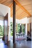 Modern home with Dining Room, Table, Concrete Floor, Wood Burning Fireplace, and Pendant Lighting. Sooke 01- Interior Photo 3 of Sooke 01 House