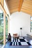 Modern home with Living Room, Wood Burning Fireplace, Floor Lighting, Concrete Floor, and Chair. Sooke 01- Interior Photo 4 of Sooke 01 House