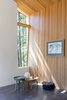 Modern home with Living Room, Chair, Wood Burning Fireplace, Floor Lighting, and Concrete Floor. Sooke 01- Interior Photo 5 of Sooke 01 House