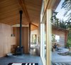 Modern home with Living Room, Floor Lighting, Chair, Concrete Floor, and Wood Burning Fireplace. Sooke 01- Wide angle Photo 7 of Sooke 01 House