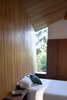 Modern home with Bedroom, Storage, Concrete Floor, Bed, and Table Lighting. Sooke 01- Interior Photo 10 of Sooke 01 House
