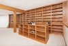 Modern home with Office, Bookcase, Shelves, Desk, Library Room Type, Storage, and Carpet Floor. Library Photo 7 of Mocking Bird