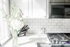 Modern home with Kitchen, Subway Tile Backsplashe, Range, Wood Cabinet, White Cabinet, and Microwave. Kitchen Photo 6 of Secret Garden