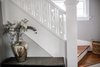 Modern home with Staircase, Wood Railing, and Wood Tread. Staircase Photo of Secret Garden