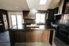 Modern home with Kitchen and Wood Cabinet. Kitchen Photo of Stone Mod