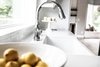 Modern home with Kitchen, Wood Cabinet, Subway Tile Backsplashe, White Cabinet, Vinyl Floor, and Engineered Quartz Counter. Faucet Photo 4 of Limoncello