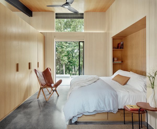 Like all the interior rooms, the furniture elements in the master bedroom have been built into the architecture, making efficient use of the compact space.