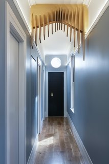 The Edwardian hallway arch had been removed from the original home, and the design team was determined to reinstate it in the renovation. When the project became a new build, they decided to continue with the reinstatement of the arch in a more contemporary way. “We have played with CNC in the past, and the outcomes have been successful,” says Spencer. “So, we decided to create an arch that undulates in the x, y and z planes.”