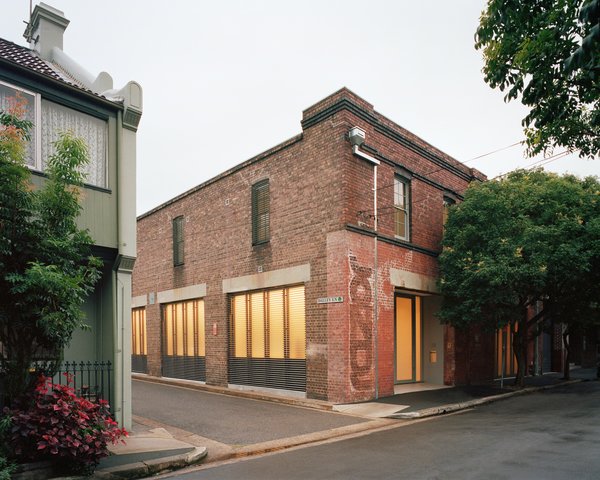 This warehouse in Sydney has served as everything from a Vegemite warehouse to an advertising agency over the years. The street-side windows have operable aluminum louvers for privacy and sun-shading.
