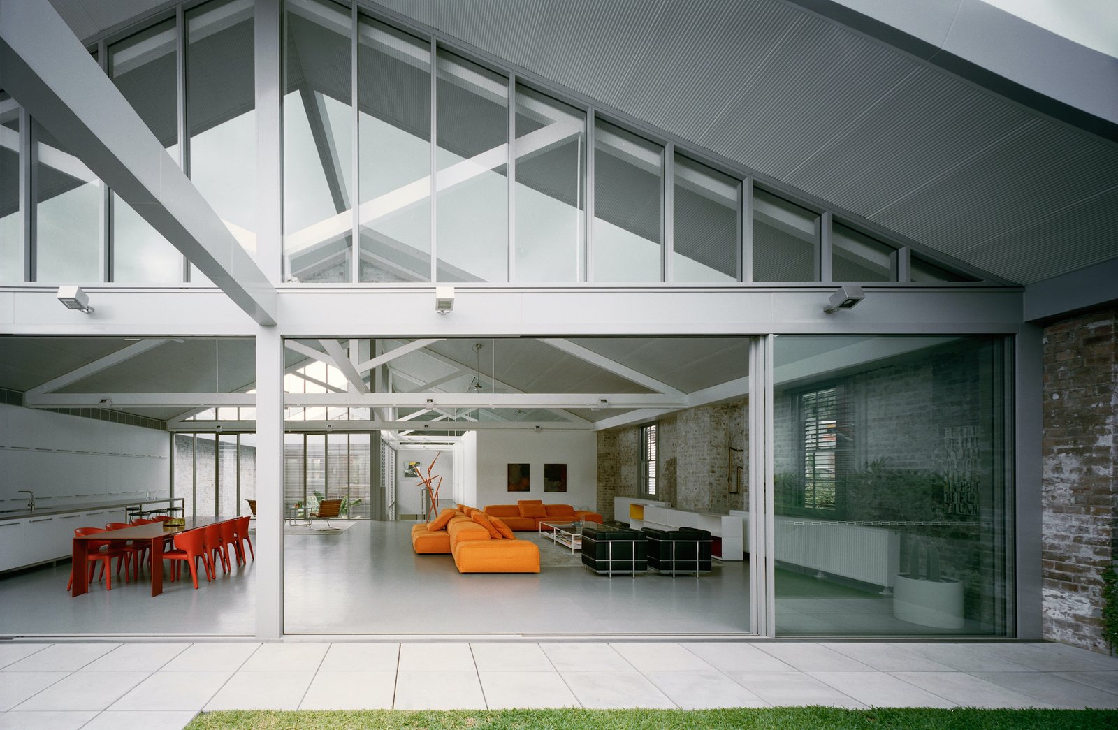 This warehouse conversion by Ian Moore Architects also features an equine genetics laboratory and an enormous garage filled with classic cars.