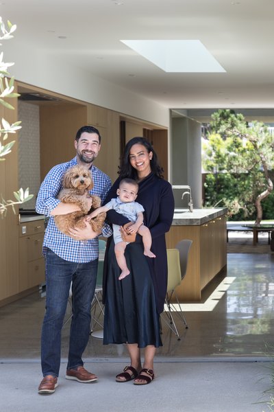 Architect Joseph Dangaran and his wife with their 17-month-old son. The couple designed the home together to meet the needs of their growing family and to showcase the work of growing architecture practice, Woods + Dangaran. 