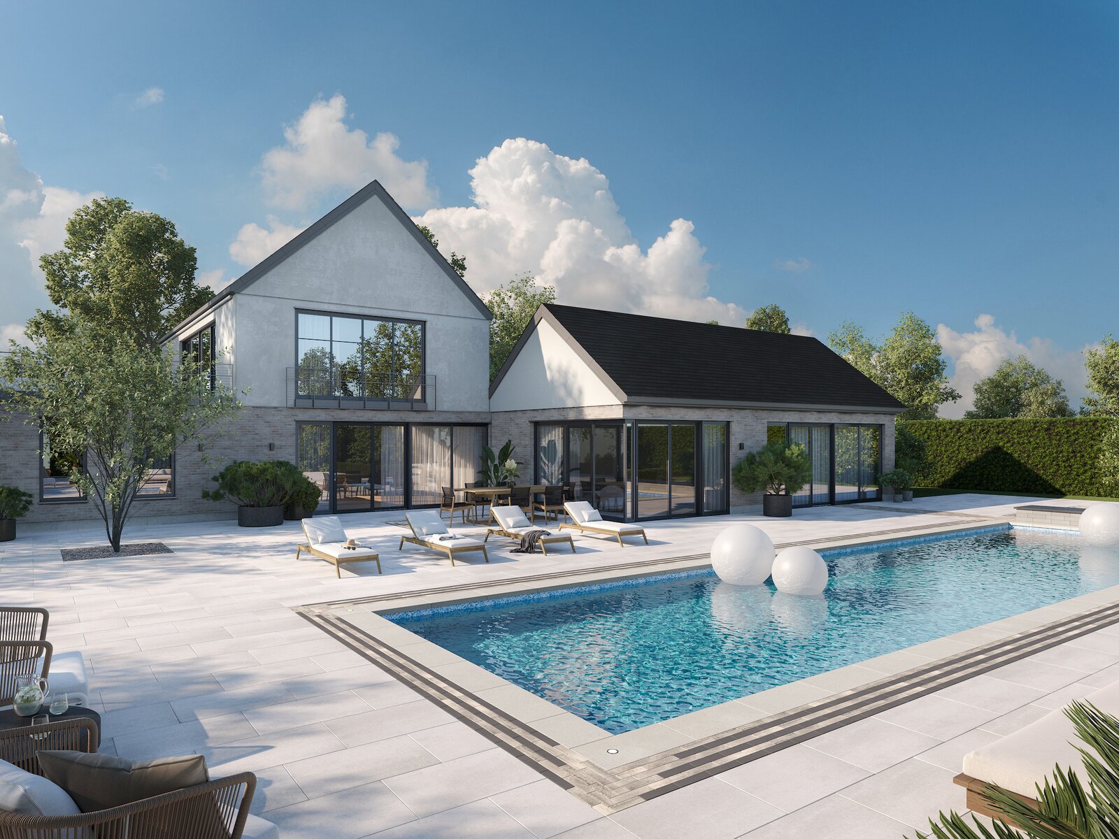 During the day, this home takes poolside relaxation to the next level, with sun loungers spread out across the patio, which is paved in a large Para slab in Greyed Nickel. The pool’s ornate edge pattern was created with the linear Westmount paver in Shale Grey and Onyx Black, and is finished with the brand’s elegant Raffinato wall cap and steps in Greyed Nickel.