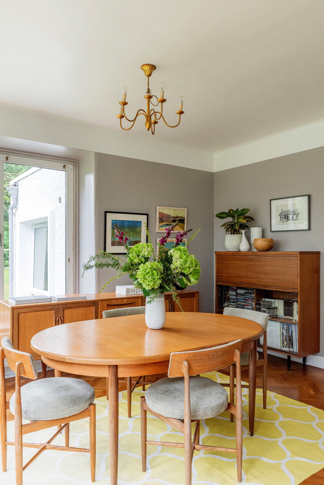 The dining area is made up of Mid-Century furniture that the couple has collected over the years.