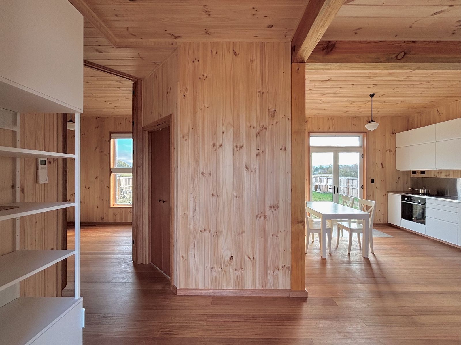 The untreated timber lining is locally sourced and left unpainted, making the house fully breathable. 