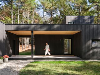 This Blackened Cedar Home Was Designed to Vanish Into the Trees—Almost