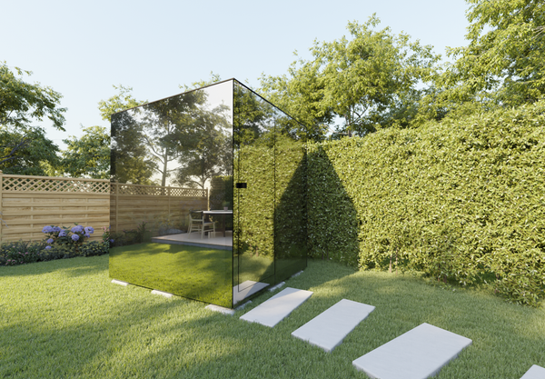 The Thermasol Vue sauna is an elegant glass form that reflects its surroundings, making it a visually unobtrusive way to introduce a sauna to the home.