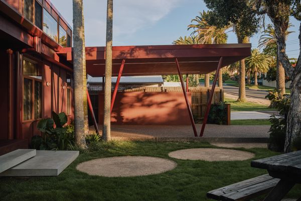 The carport pairs galvanised steel columns with a lightweight timber structure, timber fascia and a cement-sheet ceiling. Builder Josh Barker describes it as